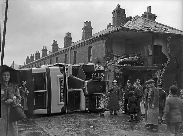 A bus on its side after being caught in the blast of a bomb in Sparkbrook