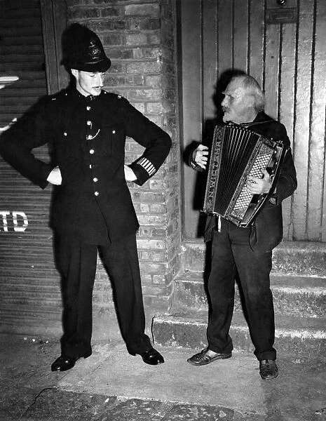 Buskers: The policeman recognizes Gus Andrews, and pauses during his beat to listen to a