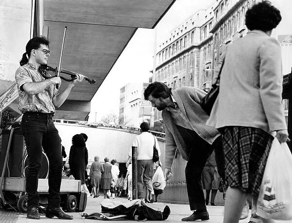 Buskers working in the streets of Birmingham. May 1985 P004925