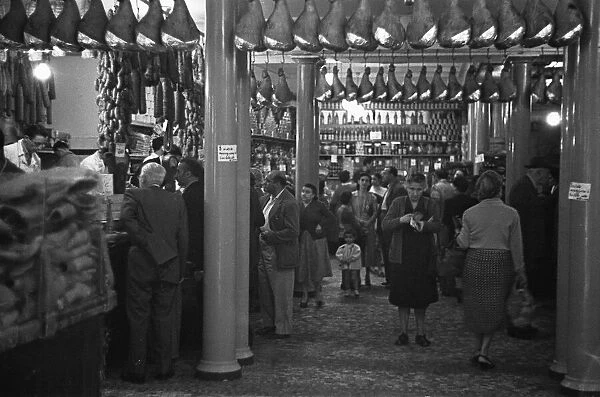 A busy Italian butchers shop, Parma, Italy Circa 1955