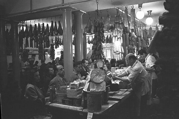 A busy Italian delicatessen shop, Parma, Italy Circa 1955