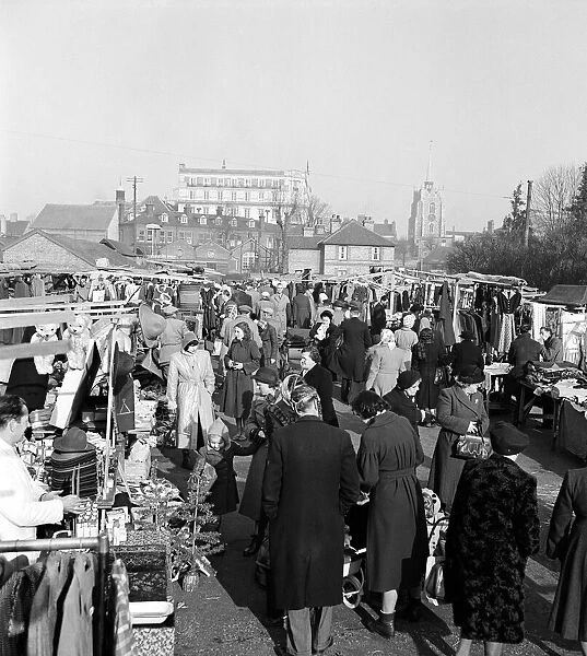 Busy scene showing shoppers and traders at Chelmsford Market in Essex. 28th November 1952