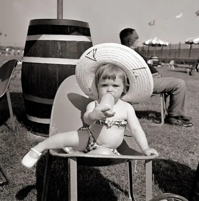Framed Print : Butlins Holiday Camp at Bognor A Little toddler wearing a floral bikini sucking Framed Print : Butlins Holiday Camp at Bognor A Little toddler wearing a floral bikini sucking