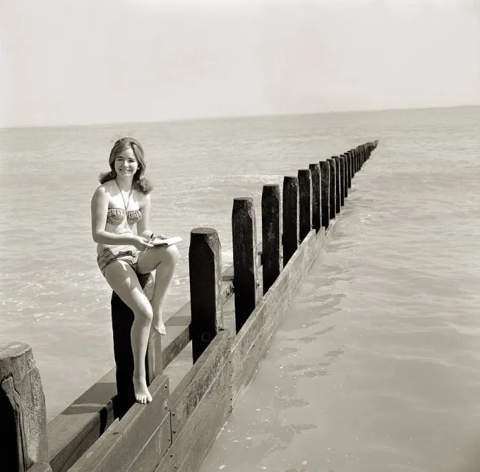Framed Print : Butlins Holiday Camp at Bognor A young woman wearing a bikini sitting on a barrier Framed Print : Butlins Holiday Camp at Bognor A young woman wearing a bikini sitting on a barrier