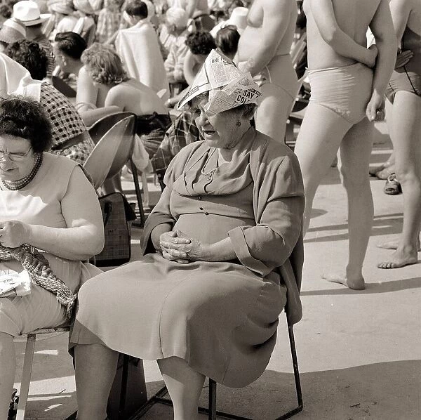 Butlins Holiday Camp in Minehead An elderly lady sitting on a chair wearing paper