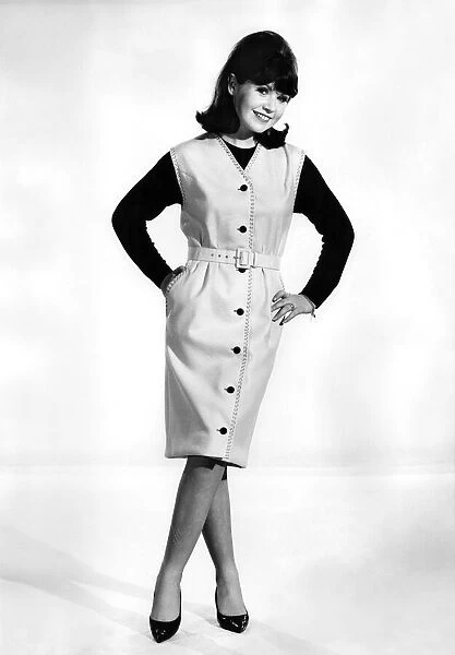 Buttoned suit dress with black jumper underneath. Reveille Fashions: Rosemary Bell