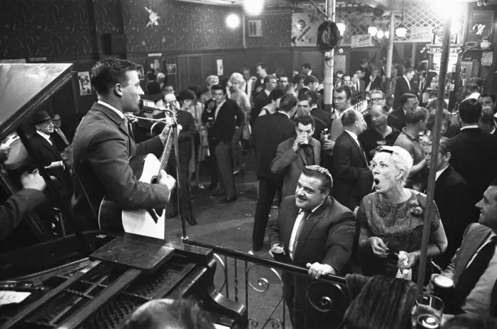 Framed Print : Cabaret singer performing in a East End of London pub on a Saturday night. 6th July 1963
