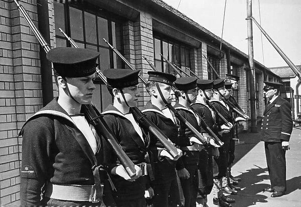 Cadets on guard duty being inspected by a Senior Officer. 6th August 1942