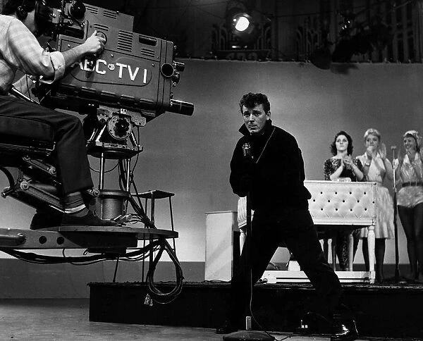The camera swings in to record American Fifties Sixties pop singer Gene Vincent