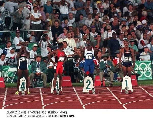 Canadas Donovan Bailey crosses the finish line to take the Gold medal in the mens