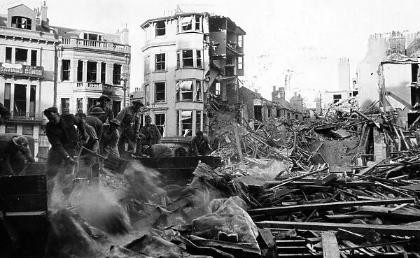 Canadian soldiers help to remove debris from bombed buildings on Hastings. 8th May 1943