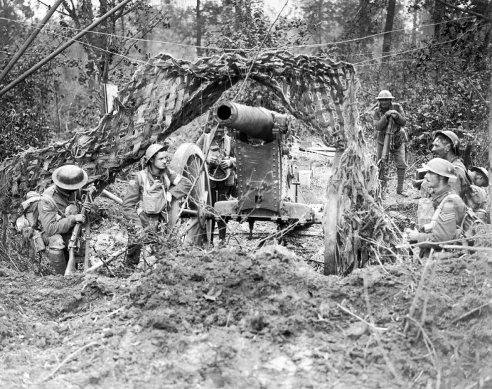 Framed Print : Canadian soldiers rest beside a captured German gun. The Germans blew away Framed Print : Canadian soldiers rest beside a captured German gun. The Germans blew away