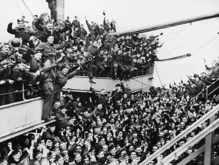 Framed Print : The Canadian Troops Arrive in Britain, waving as their transport docks at a North Western
