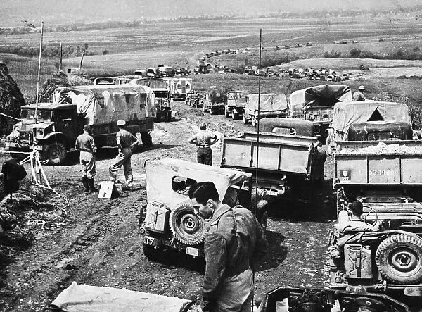 Canadians in Italy. Army supply vehicles jam the road leading to the front through