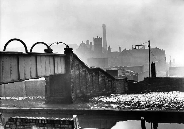 A canal bridge, Bootle Hospital in the background. January 1958