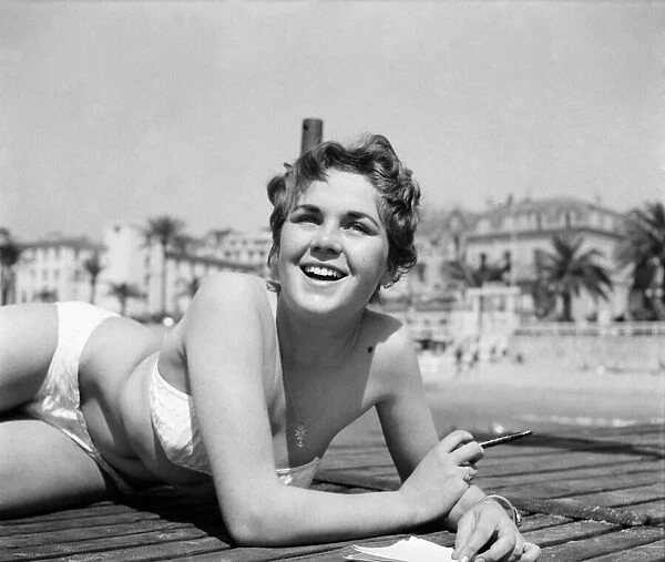 Cannes Film Festival 1953. Lise Michaud seen here modeling a bikini on a speed boat just