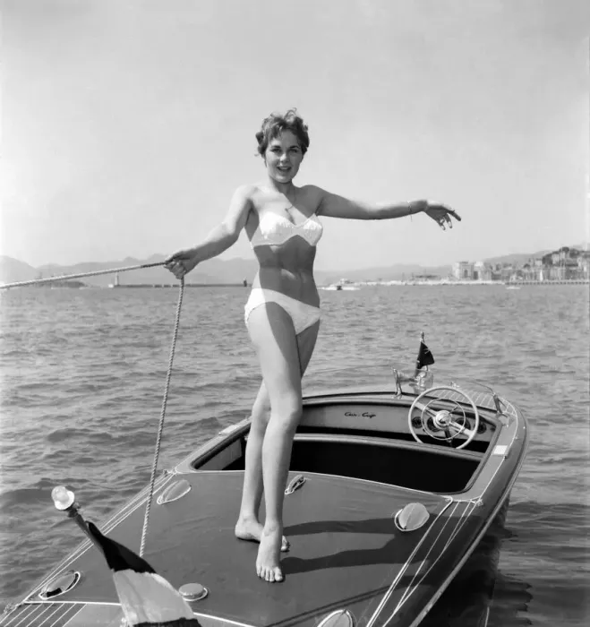 Framed Print : Cannes Film Festival 1953. Lise Michaud seen here modeling a bikini on a speed boat just