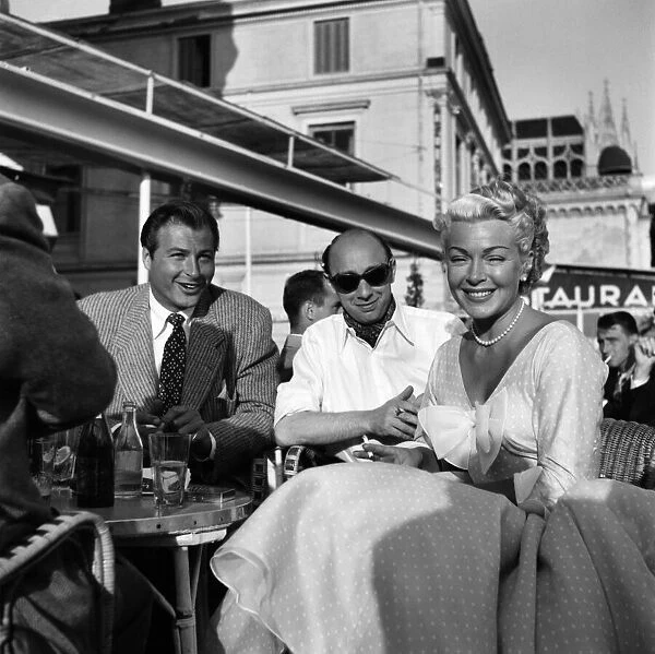 Cannes Film Festival 1953. Right Lex Barker with Donald Zec and actress Lana Turner