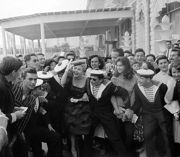 Cannes Film Festival May 1958 Mitzi Gaynor gets a kiss from a French sailor as she