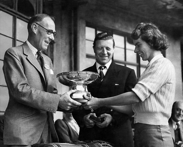 Capt. of Birkdale Golf Club, Mr. R. S. Kirkpatrick (left), presenting Miss F