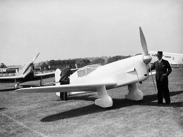 Captain Percival seen her with his Mew Gull aircraft at the 1935 Hendon Air Display 29th