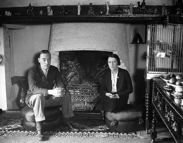 Captian Malcolm Campbell motor racing driver at home with his wife. Circa 1930