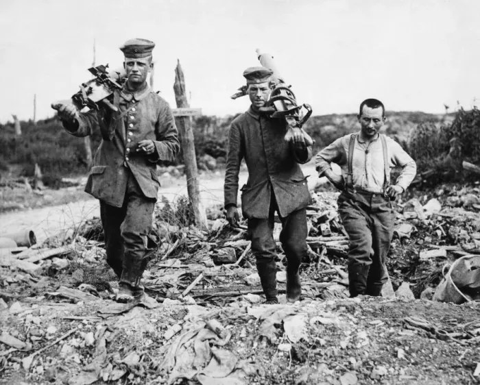 Framed Print : Captured German machine gunners carrying their guns following the Battle of Messines