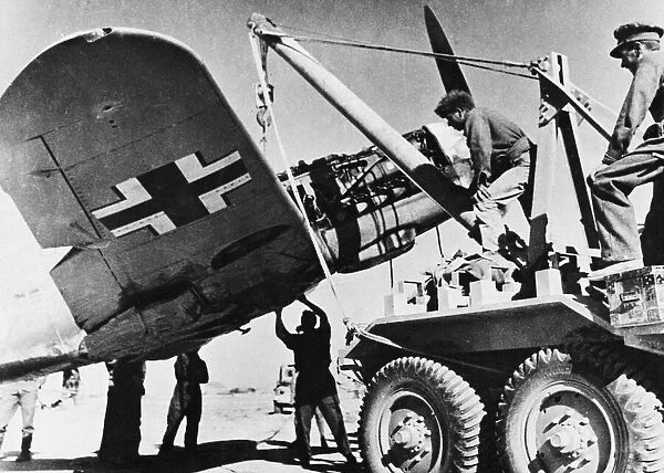 Captured Messerschmitt being hoisted on to a carrier. 29th January 1942