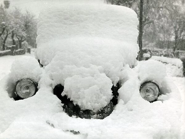 A car covered in snow after a heavy snowfall in Kent December 1962 A©