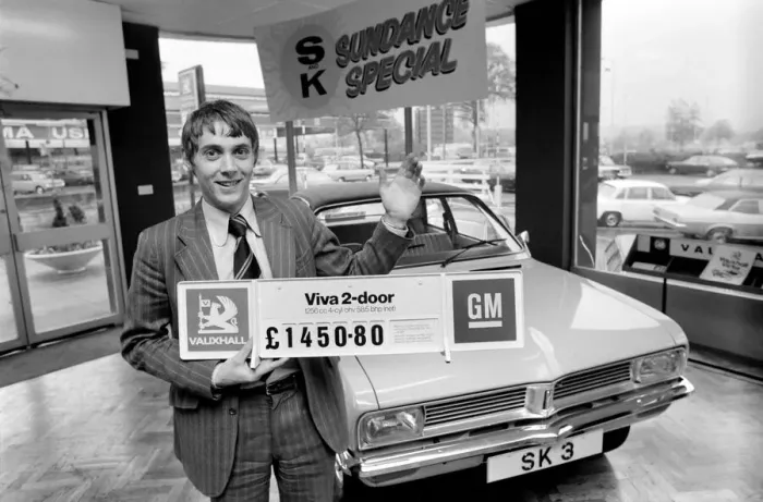 Framed Print : A car dealer putting cars on sale in his garage forecourt in Brighton. May 1975 Framed Print : A car dealer putting cars on sale in his garage forecourt in Brighton. May 1975