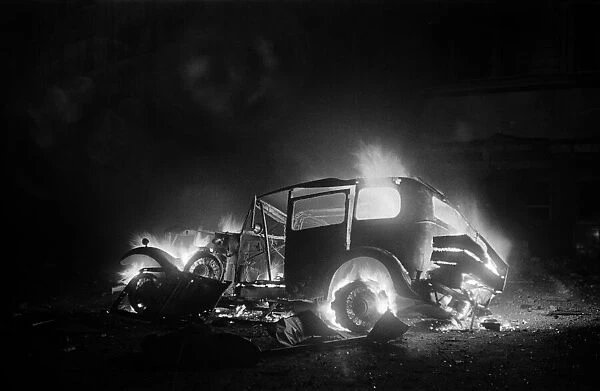Car on fire outside St Pauls Station. 11th January 1941