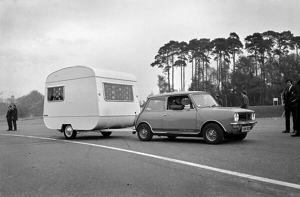 A caravan being towed by a mini clubman car. November 1969 Z10726-001