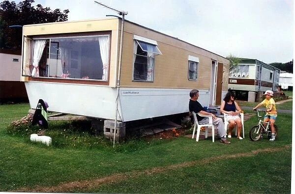 Caravans - Holidaymakers enjoying the afternoon sun at a caravan park. 20th July 1994