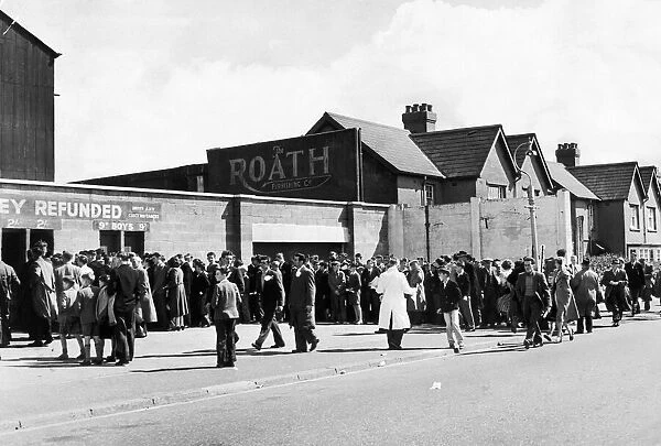 Cardiff City fans queue at the turnstiles for the big game, 26th August 1957