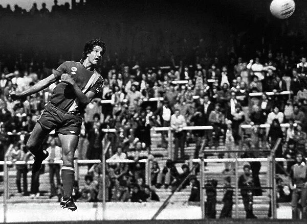 Cardiff City ss Welsh international defender Phil Dwyer leaps to head home