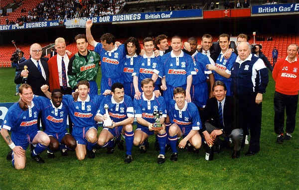 The Cardiff City team pictured with the Third Division title trophy