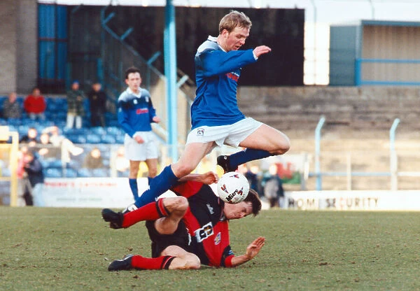 Cardiff City v Colchester United. Gareth Stoker of Cardiff jumps over a Colchester player