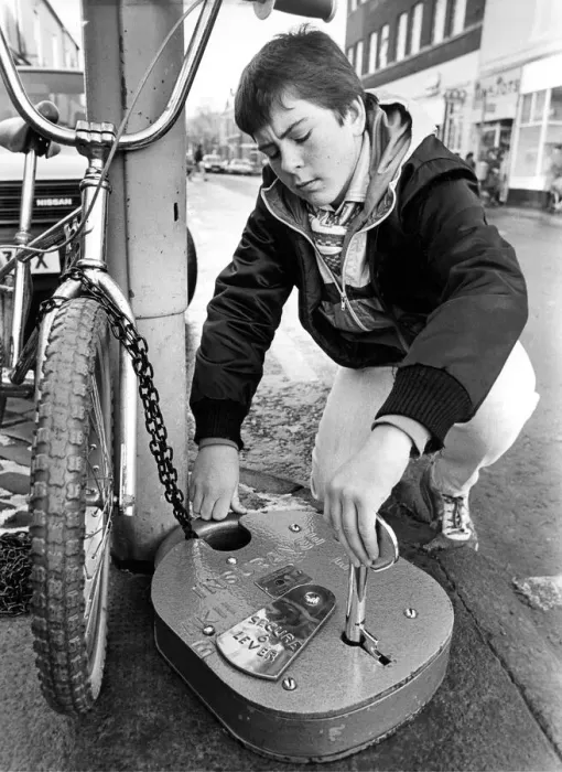 Framed Print : You cannot be too careful these days so Tyneside BMX biker Paul Snowden locks up his bike Framed Print : You cannot be too careful these days so Tyneside BMX biker Paul Snowden locks up his bike