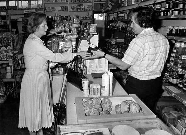 Careful Shopper: Mrs. Margaret Thatcher with grocer John Shean. March 1983 P005083