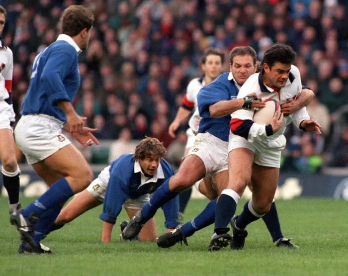 Framed Print : Will Carling is tackled as he tries to break the Italian defence during the England v