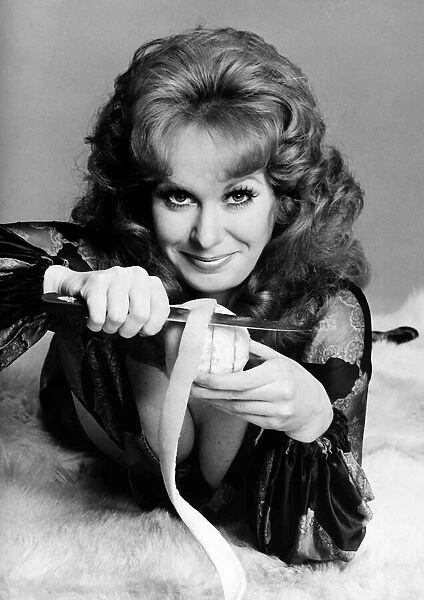 Carol Cleveland actress peeling orange with knife 1971