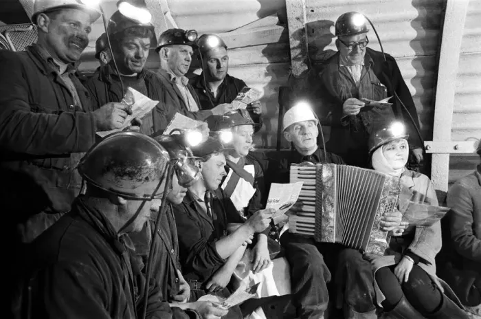 Framed Print : Carol service by miners 600 ft down. An accordion play and miners voices are raised in Framed Print : Carol service by miners 600 ft down. An accordion play and miners voices are raised in
