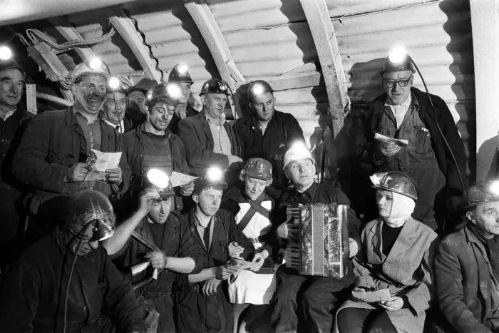 Framed Print : Carol service by miners 600 ft down. An accordion play and miners voices are raised in Framed Print : Carol service by miners 600 ft down. An accordion play and miners voices are raised in