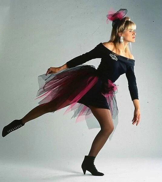 Carol Smillie model TV presenter wearing black dress with pink net around it