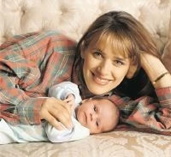 Carol Smillie tv presenter with baby Christie