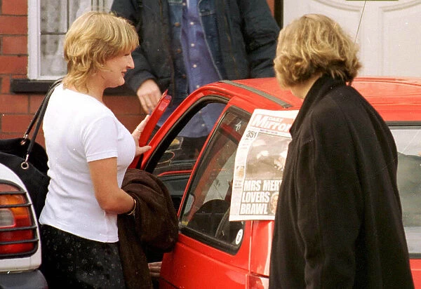 Caroline Aherne who plays television characture Mrs Merton is shown a copy of the Daily