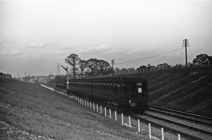 Framed Print : A three carriage Electric Multiple Unit train seen here on the Chessington branch line Framed Print : A three carriage Electric Multiple Unit train seen here on the Chessington branch line