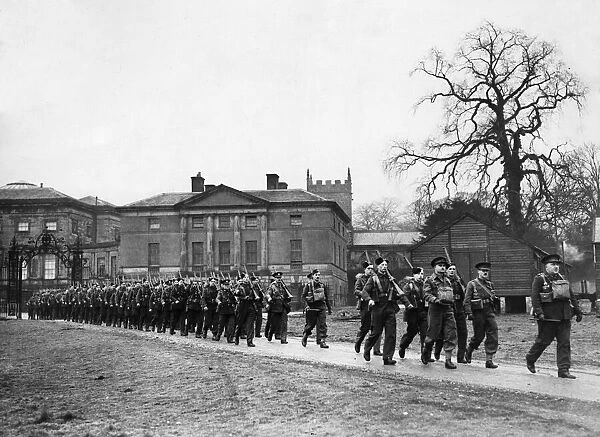 Carrying their full kit, these men of an Infantry regiment start out on a route march