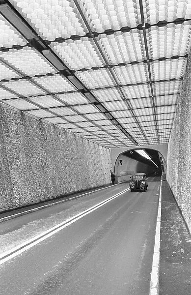 Cars seen here emerging from the newly opened Dartford Tunnel linking Essex to Kent
