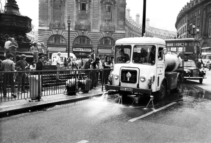 Framed Print : The cart drenching the gutter and splashing the hippies yesterday. August 1969 P004939